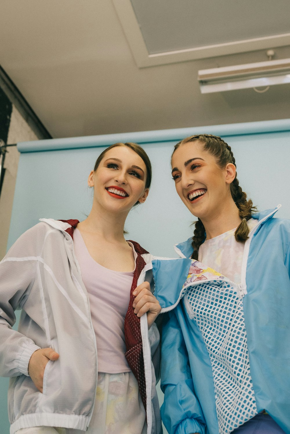 two woman making face