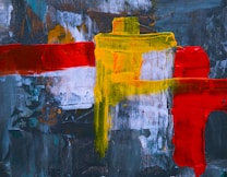 Abstract painting with bold, textured brushstrokes featuring vibrant yellow and red colors over a dark blue and gray background. Layers of paint create a dynamic composition with contrasting colors.