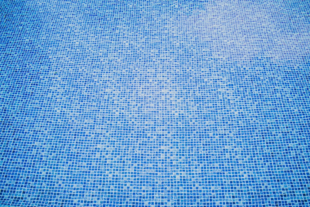 a blue swimming pool with a lot of water