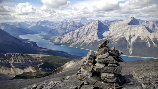 high-angle photography of mountain cliff in Spray Lakes Reservoir Canada