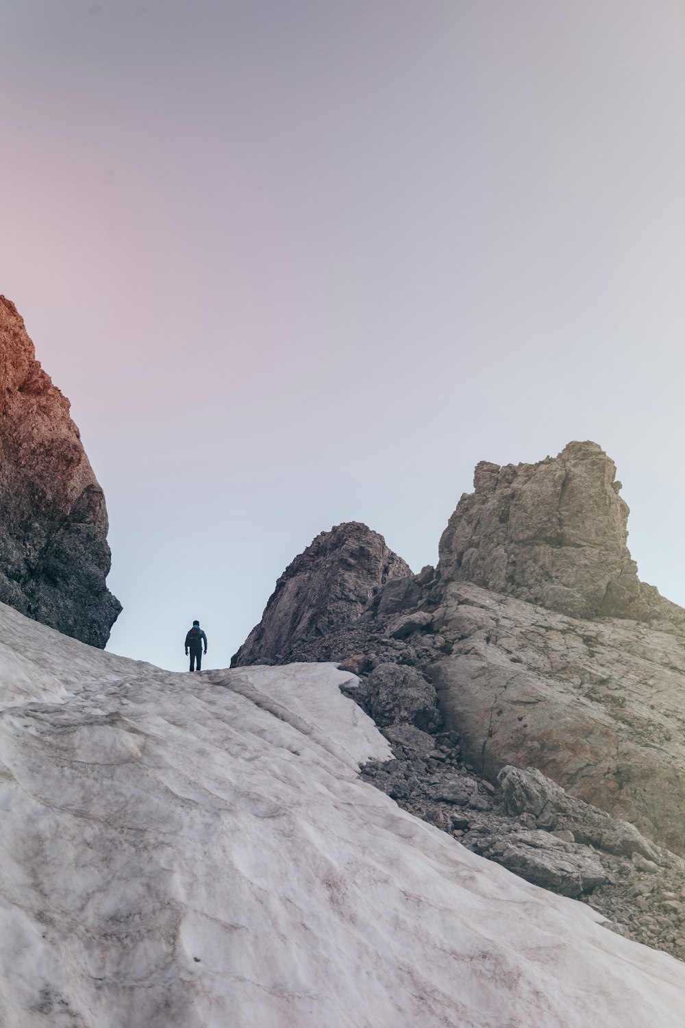 man standing on mountain peak