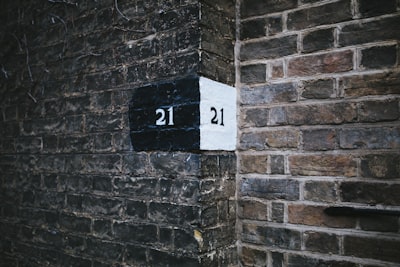 brown brick wall showing numbers