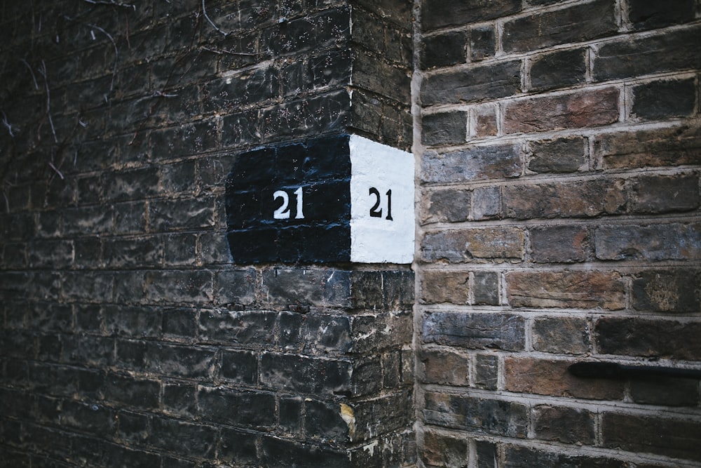 brown brick wall showing numbers