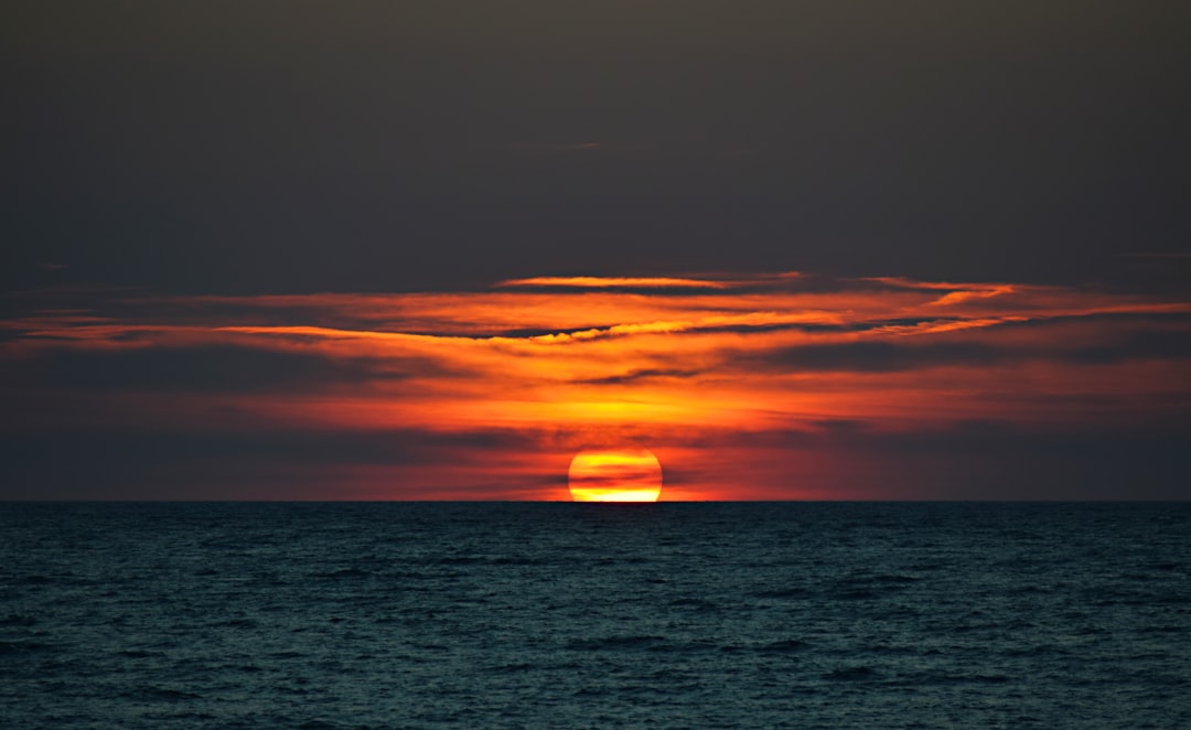 sunset on body of water