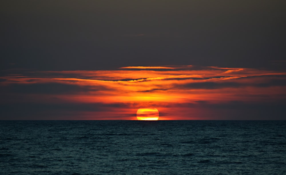 sunset on body of water