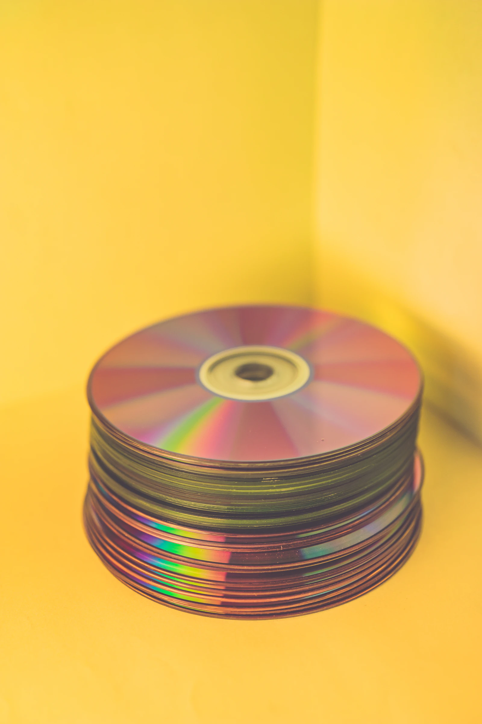 Stack of compact discs representing physical music releases