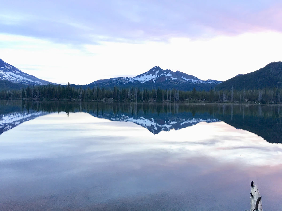 A snowy peak reflected in a calm lake
