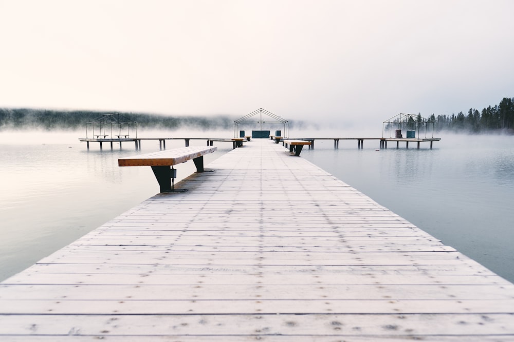 brown bench on brown wooden bridge