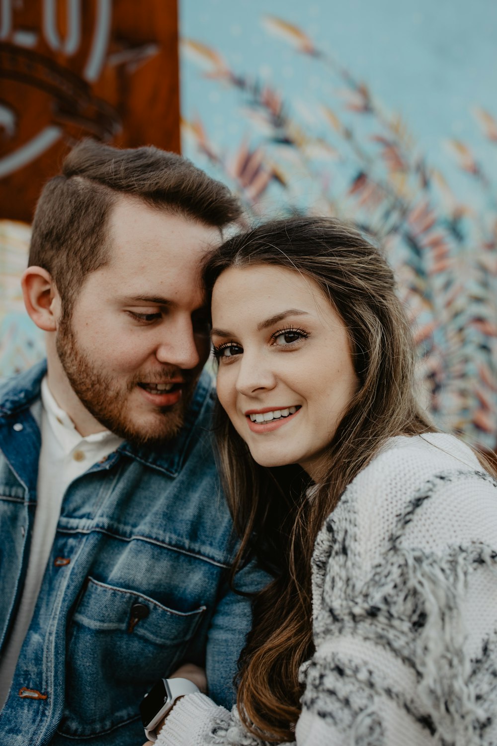 woman and man wearing white sweater