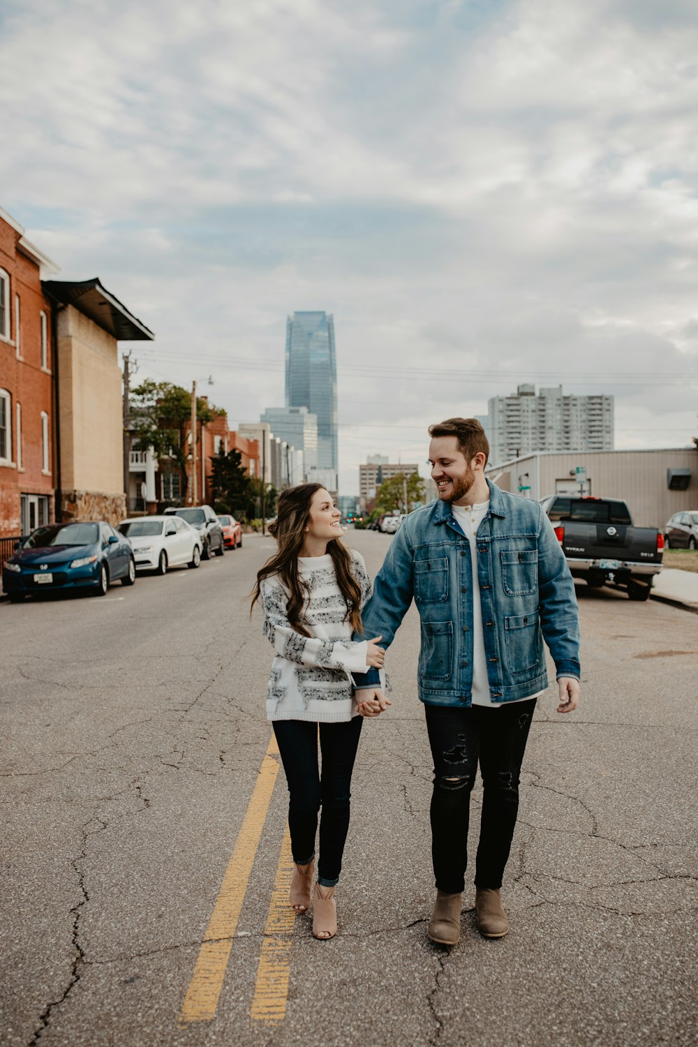 man and woman standing on road