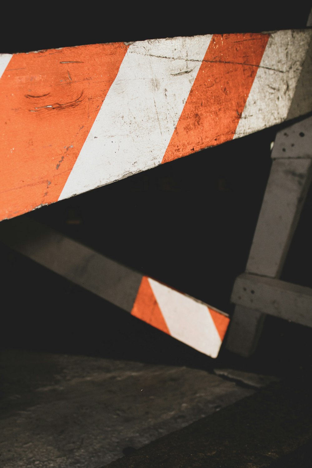 orange and white striped traffic barrier