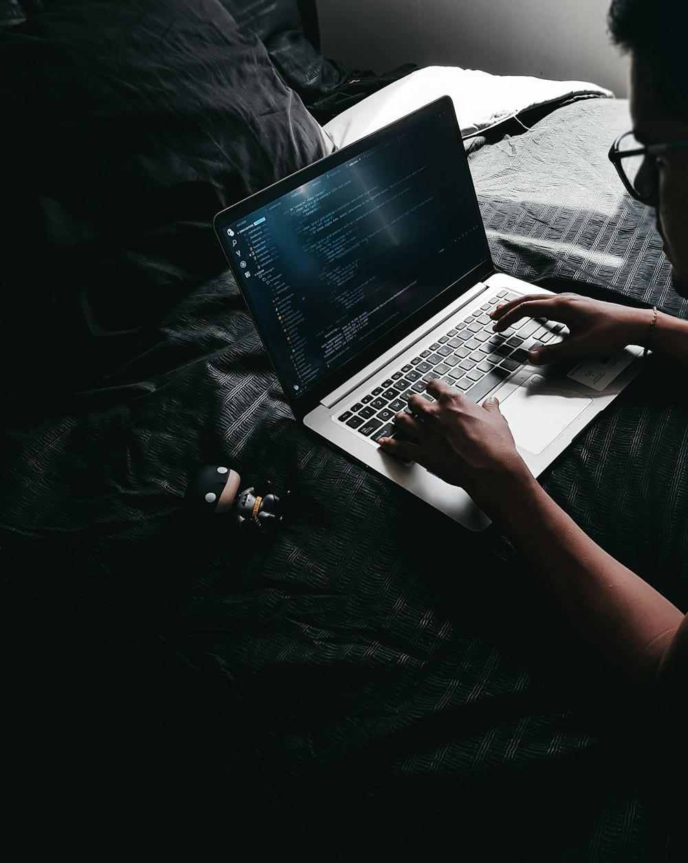 man using MacBook on table