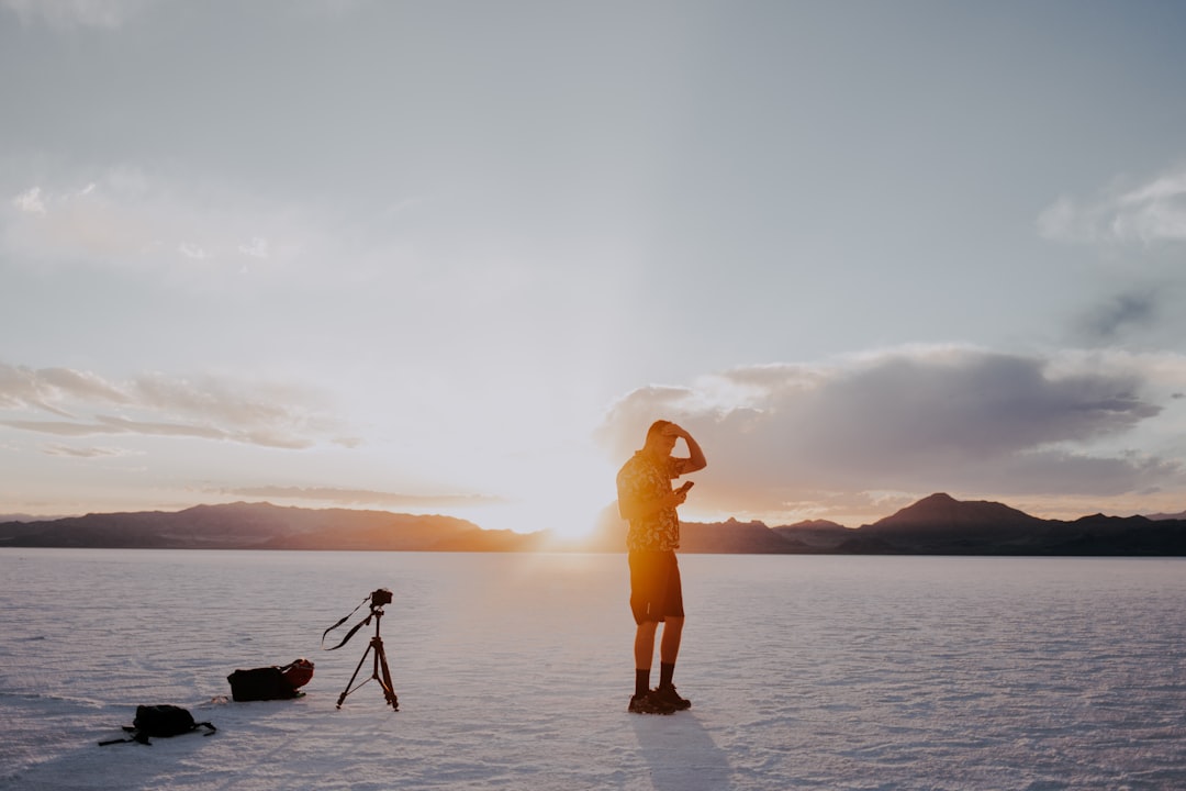 man standing on ice field