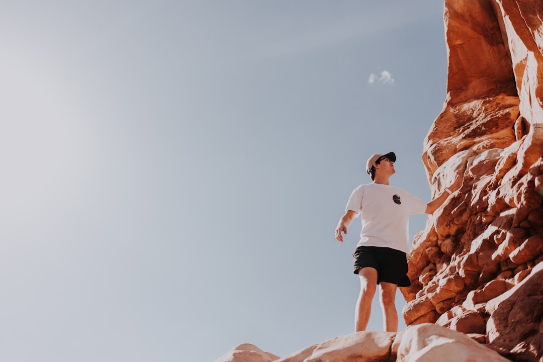 man standing on cliff