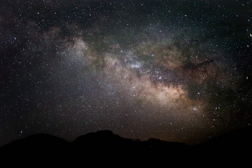 silhouette photography of mountain under sky