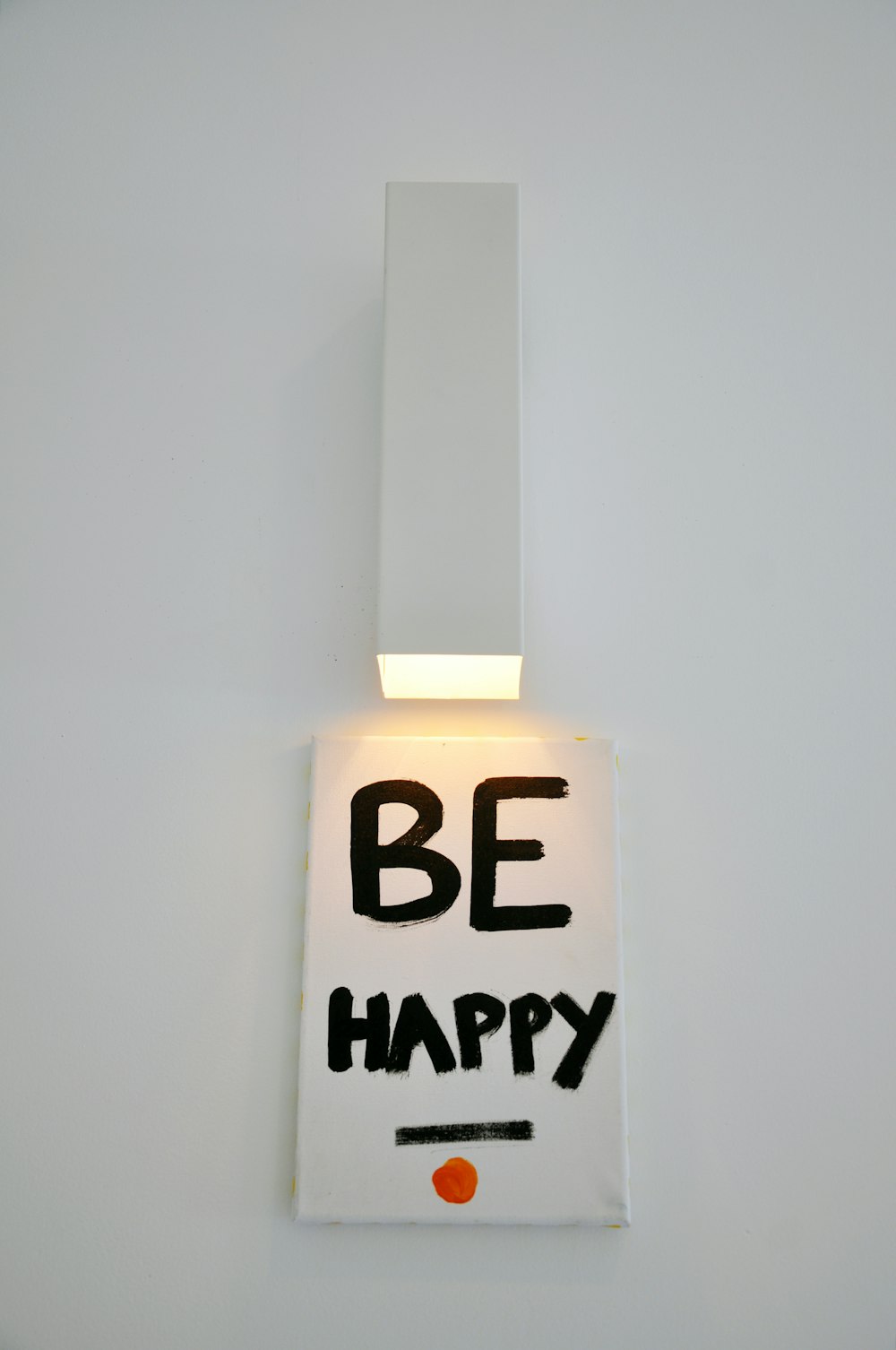 be happy sign on white surface