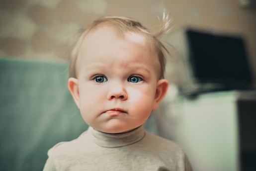 selective focus photography of baby