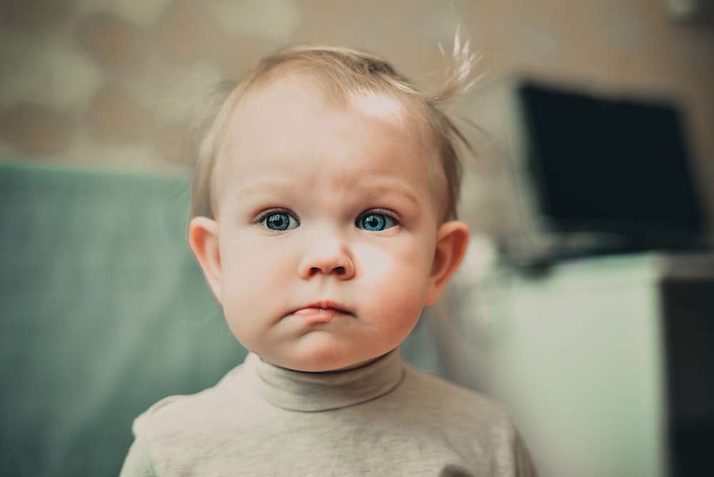 selective focus photography of baby