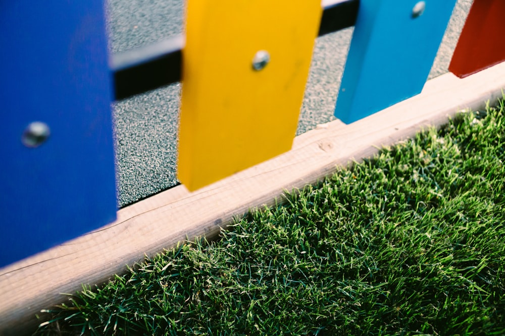 a close up of a colorful wooden fence