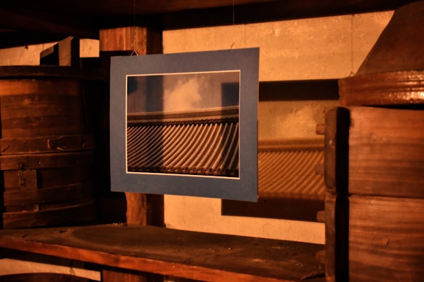 A framed professional photograph from uvezeta’s collection displayed on a dark wall.