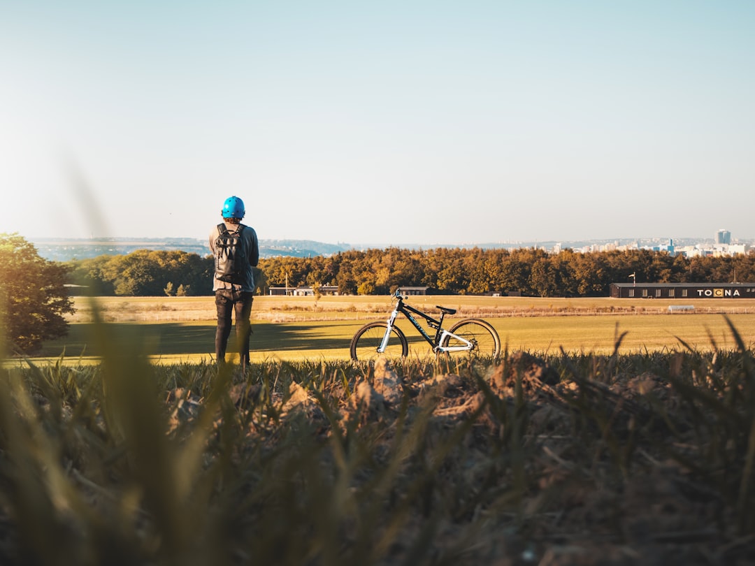 man standing on grass field