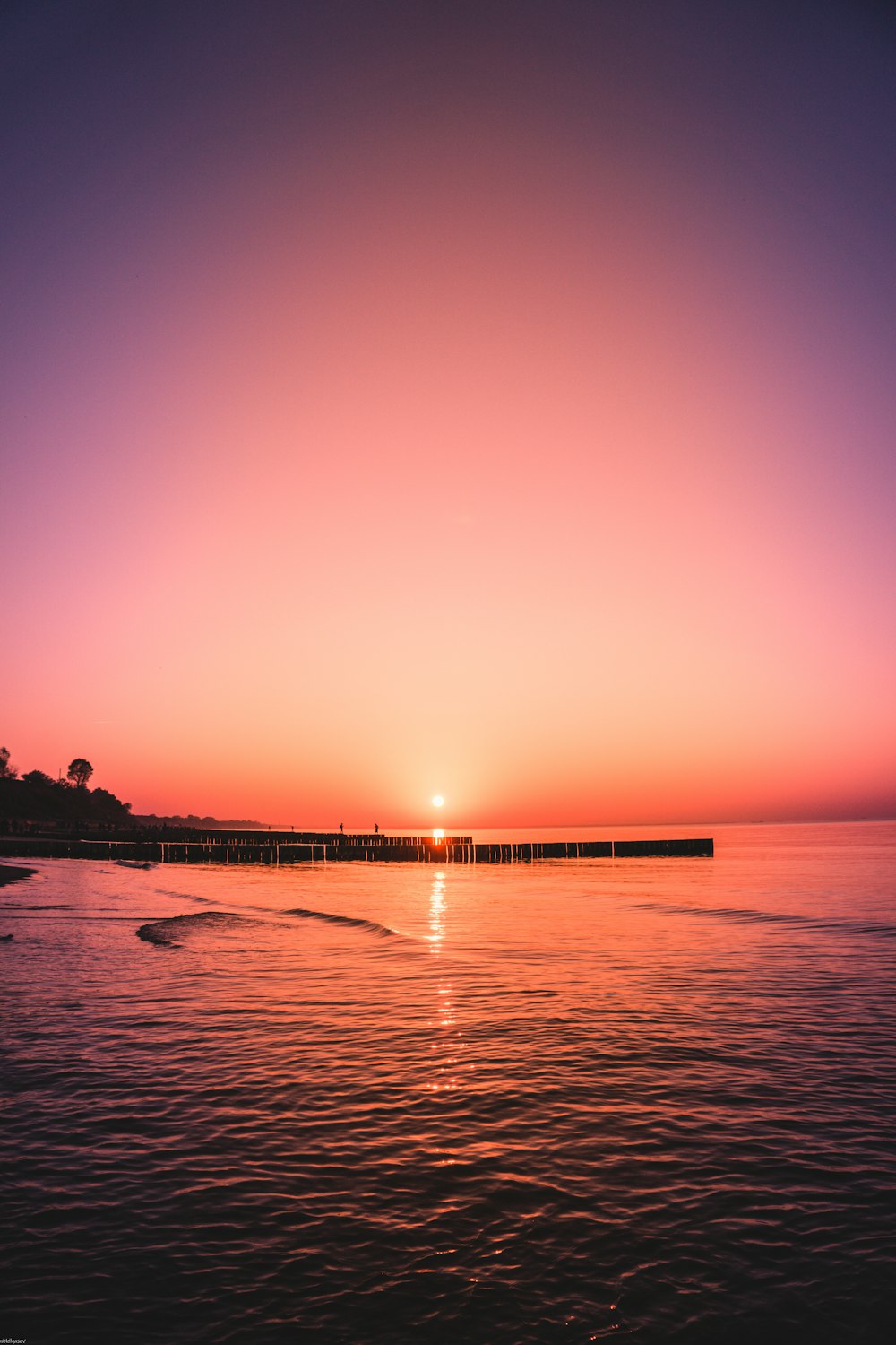 black dock during sunset