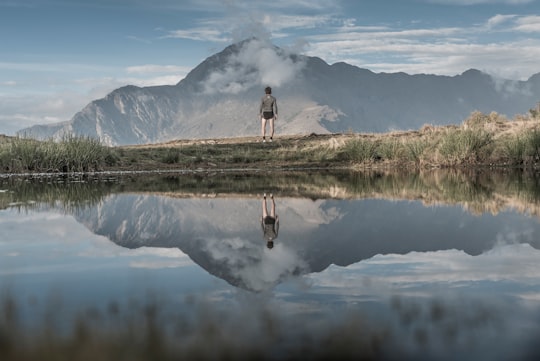 man standing near body of water in Giumello Italy