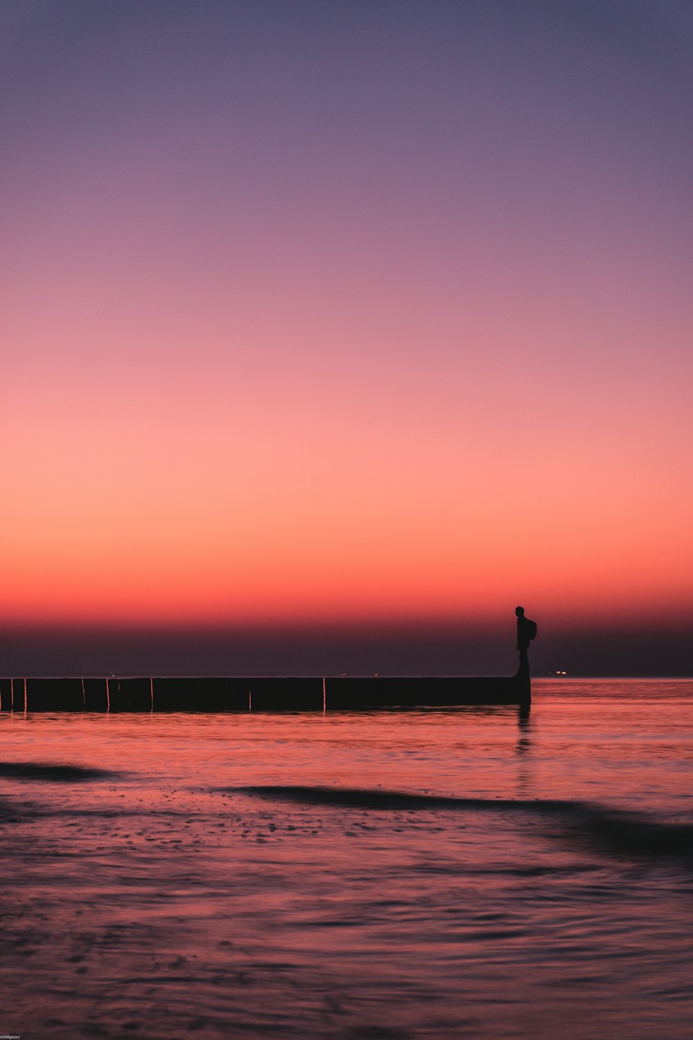 person standing on dock