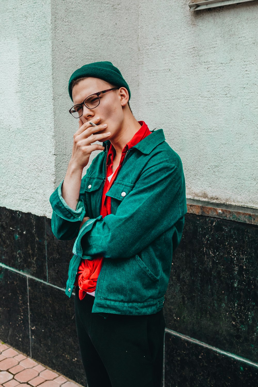 man smoking cigarette during daytime