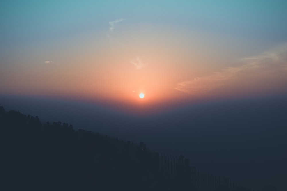 silhouette of mountain under golden hour