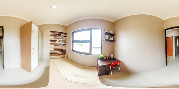 Minimalist office room bathed in natural light with colorful beige and orange themed Korean blinds on windows.