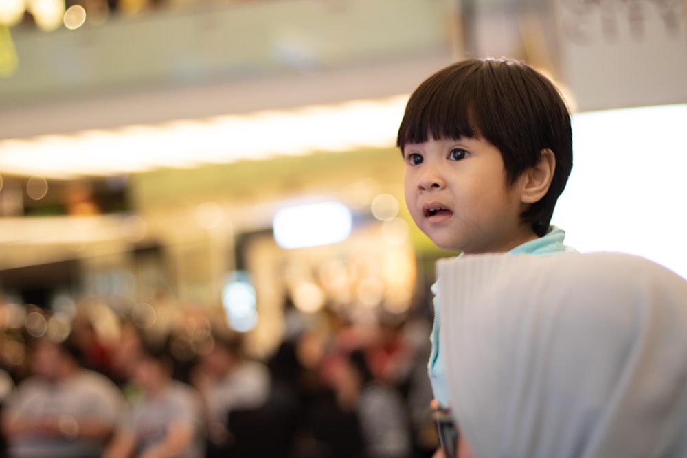 boy wearing teal top