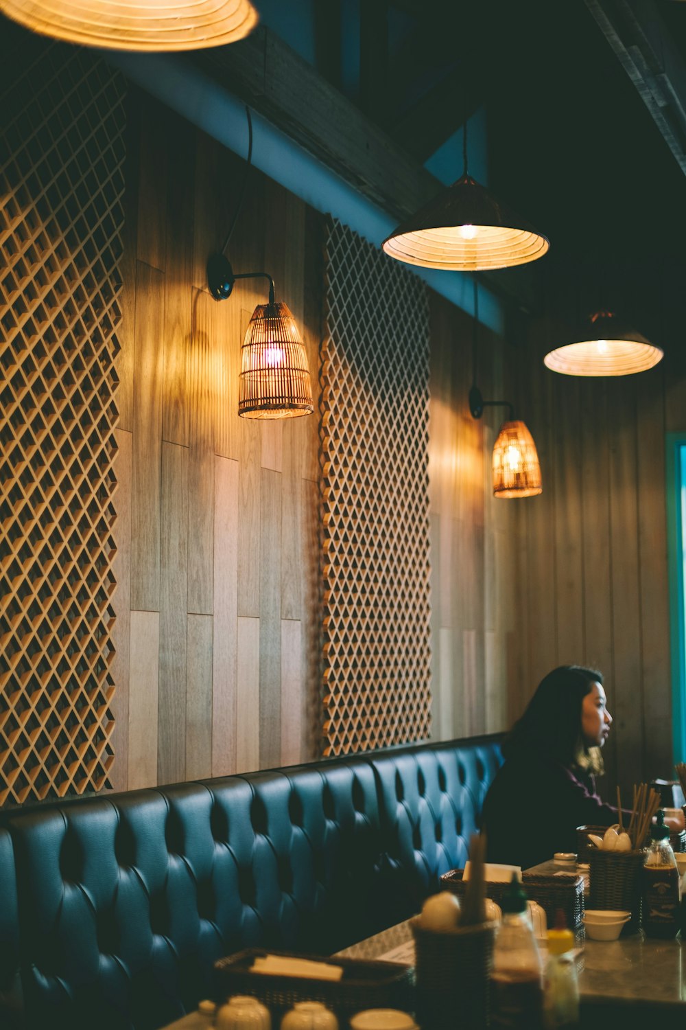 woman sitting near wall