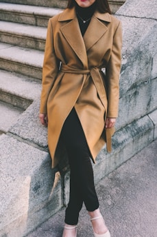 woman wearing brown notched lapel coat