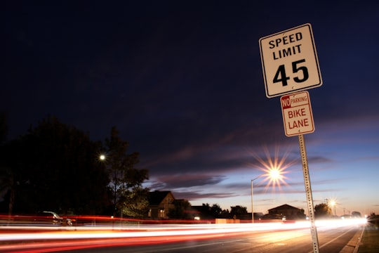 time lapse photography of speed light signage beside road in Los Banos United States