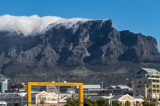 Panoramic view of Cape Town's coastline with Table Mountain backdrop.