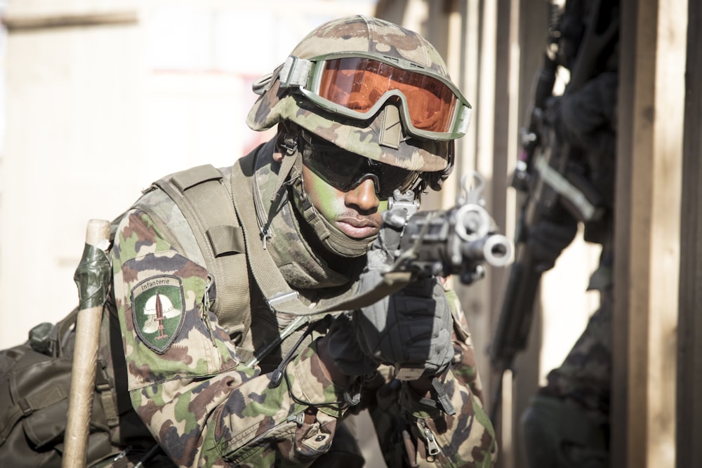 soldier holding assault rifle