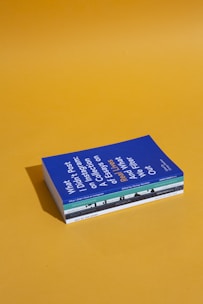 four assorted-title books