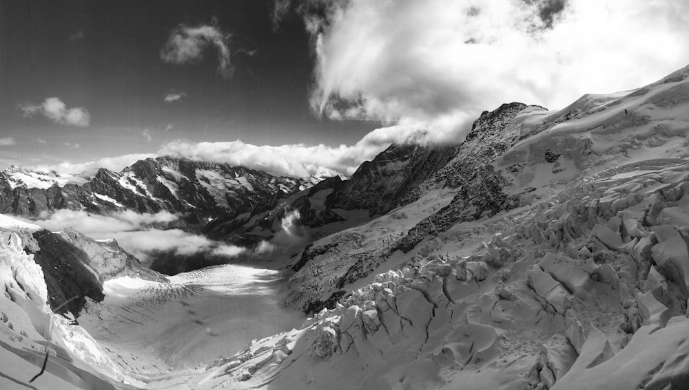grayscale photography of mountain covered with snow