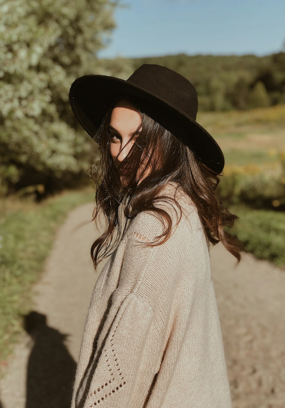 woman wearing black sun hat