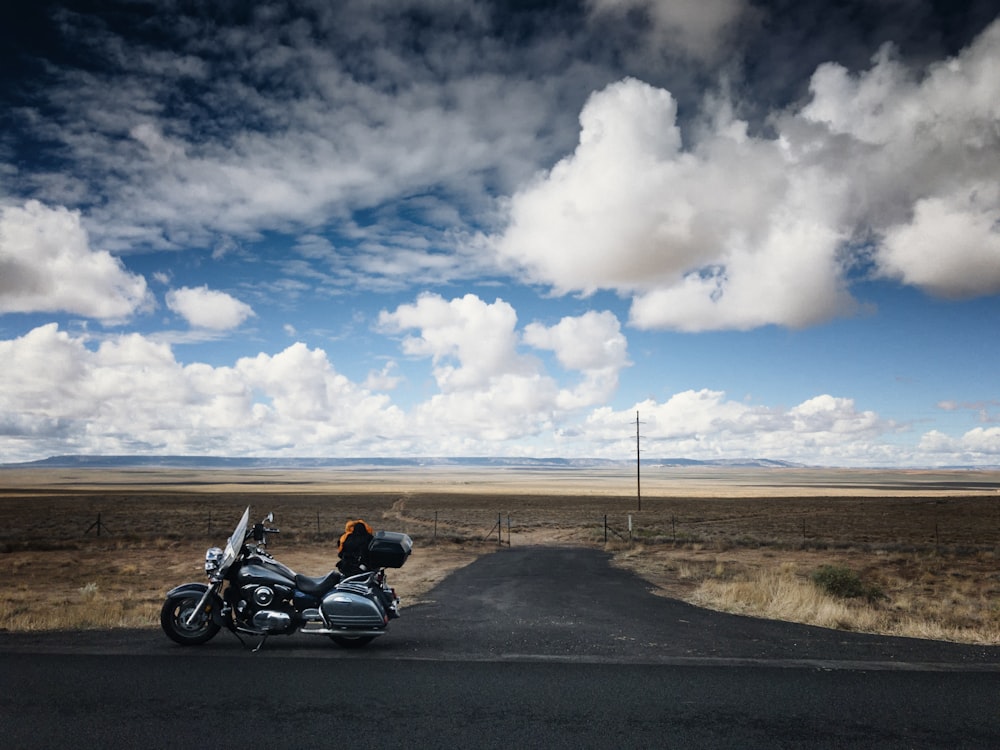 black touring motorcycle on road