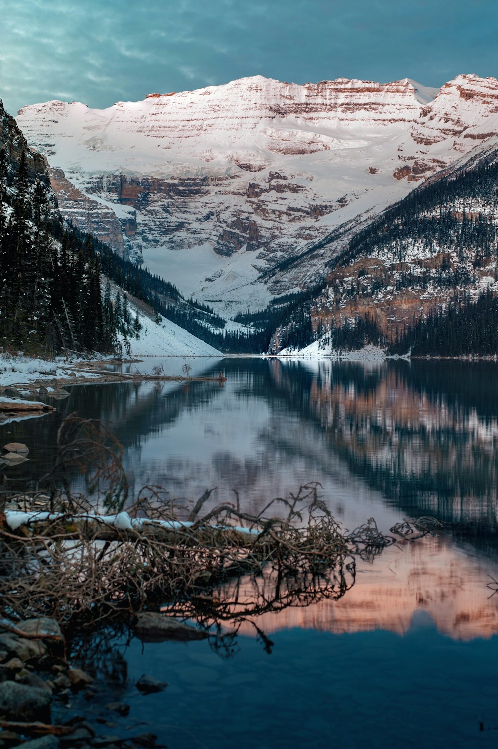 panoramic photography of snow-covered mountain near lake during daytime