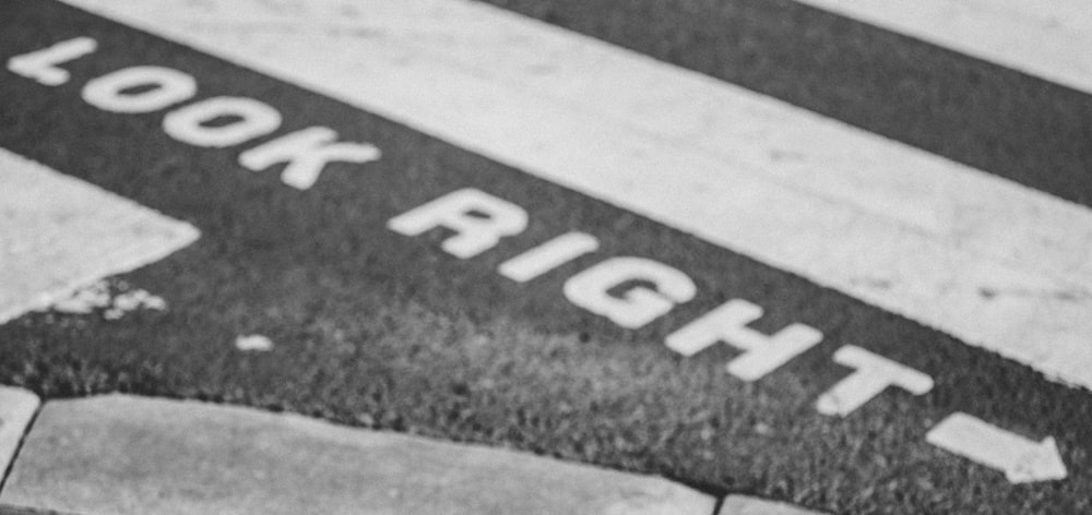 a black and white photo of a stop sign