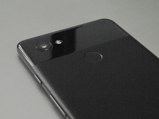 A close-up of a gently used smartphone showing its clean screen and body.