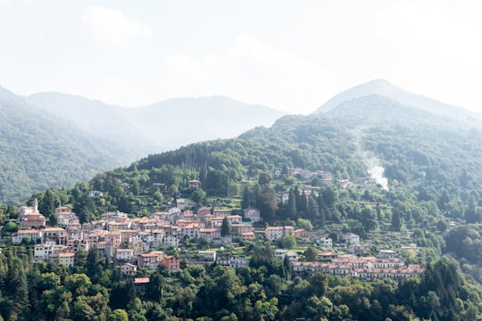 aerial photo of buildings on mountains at daytime in Faggeto Lario Italy