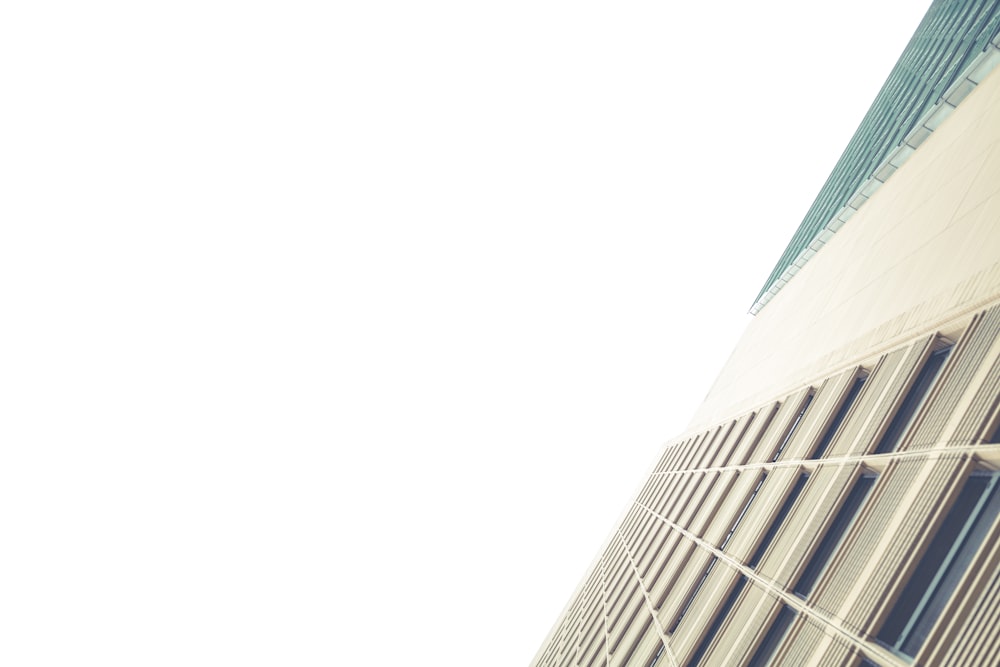 low angle photography of white concrete building