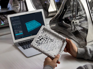 person holding 3D printed frame