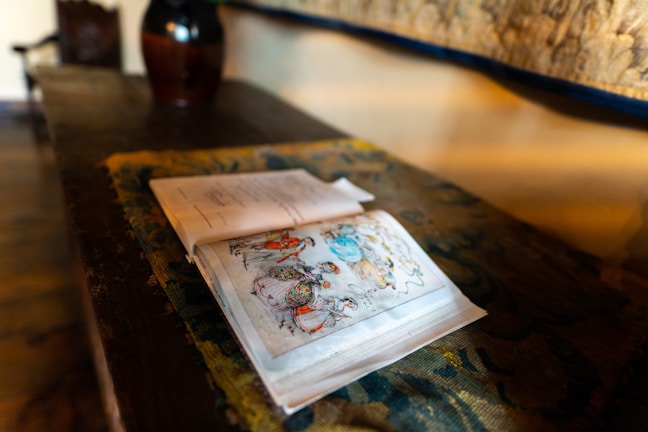 An open book with illustrations of various cultures.