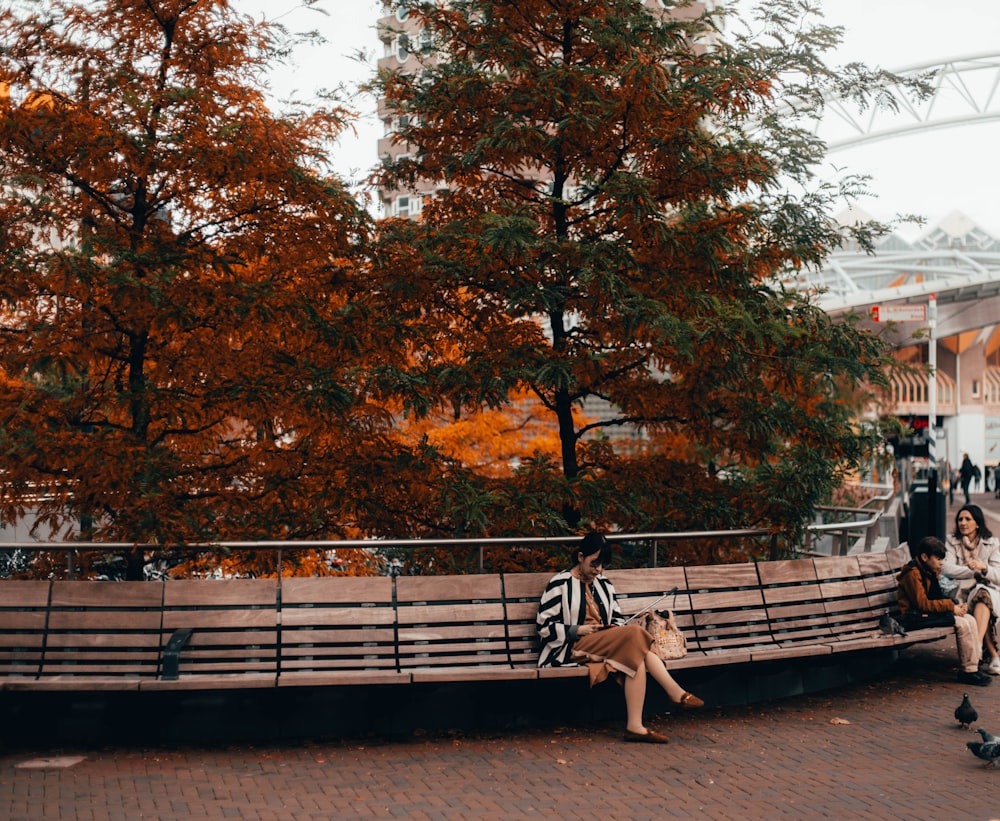 woman sitting on beige bench