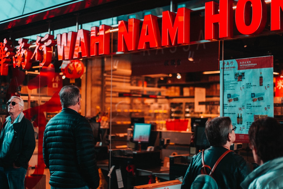 people standing in front of Wah Nam hotel